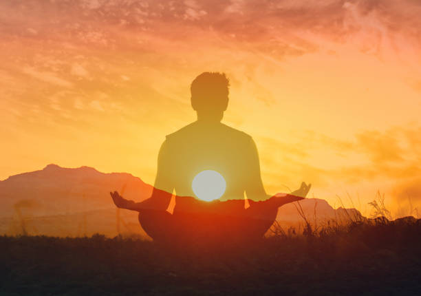istock Men meditating early morning when sun rises. 2166389829