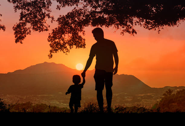 istock Father teaching his little boy to walk. First steps. 2166390043