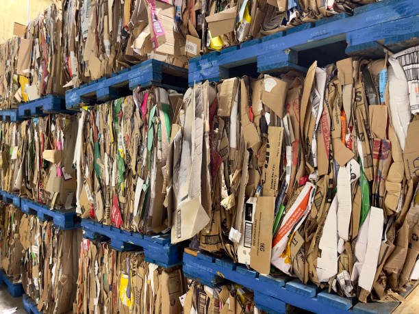 istock Compressed cardboard packaging piled up for recycling 2166390594