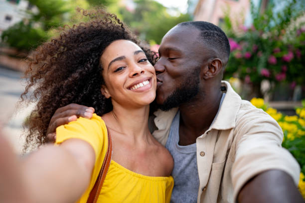 istock Loving couple taking a selfie while giving a kiss 2166394270