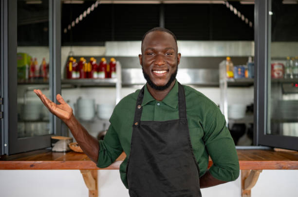 istock Happy cook welcoming clients at a restaurant 2166394278