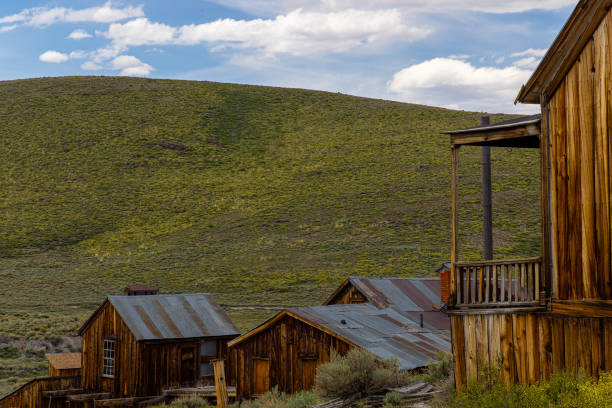 Bodie was a quintessential California boomtown, driven by the gold rush of the 1850s. At its peak in the late 1800s, it boasted nearly 2,000 buildings and a population between 5,000 and 7,000. Today, fewer than 200 buildings remain, yet Bodie is still one of the largest ghost towns in the United States. It is designated as a California State Historic Park and a National Historic Landmark, attracting approximately 200,000 visitors annually.