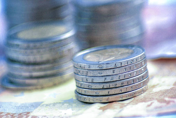 Stack of coins and banknotes of European currency EURO