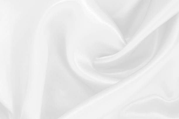 istock White fabric texture for background and design, beautiful pattern of silk or linen. 2166401504