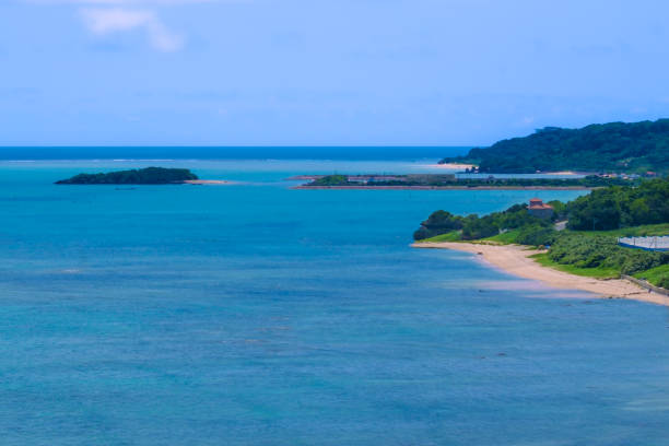 Okinawa's blue sea and a small sandy beach spreading out on a cape