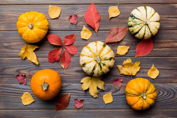 istock Autumn composition. Pattern made of dried leaves and other design accessories on table. Flat lay, top view 2166405852