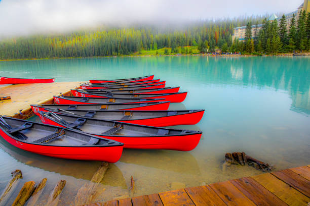 Banff Canada lake Louise canoes with contrasting red and blue