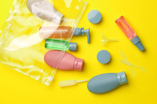 istock Travel Size Bottles And Containers in a bag On A Yellow Background 2166407706