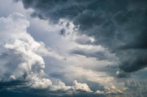 Dramatic dark sky before rain. Huge dark cumulus clouds in an empty sky.