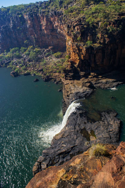 istock Last cascade of Mitchell Falls flowing down into the lower pool surrounded by red sandstone cliffs, Kimberleys, Western Australia 2166408333