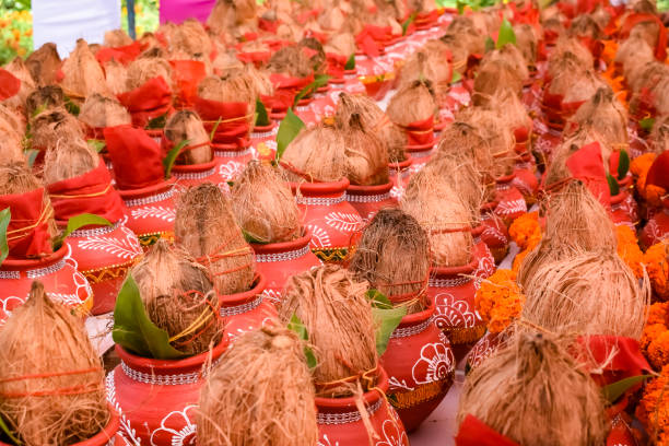 istock Kalash with coconut and mango leaf with floral decoration earthen pots containing sacred water. Kalash for hindu puja during Jagannath Temple Mangal Kalash Yatra, front view, closeup 2166408338