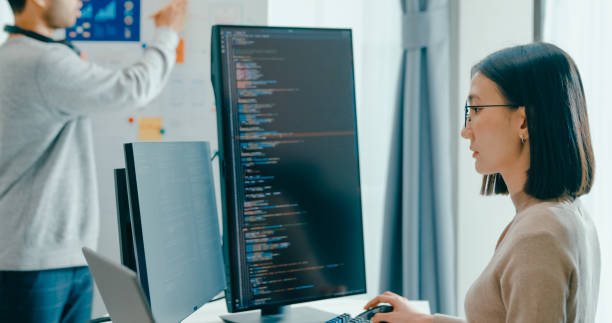istock Group Asia male female software developers mentor leader manager talk strategy plan to executive write prompt AI bot IT app program nomad, video game, data center. Whiteboard slideshow code. 2166408565