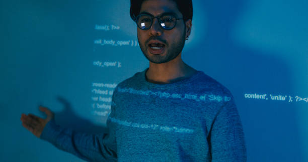 istock Group Asia male software developers mentor leader manager talk strategy plan to executive write prompt AI bot IT app program nomad, video game, designer, data center. Projecting slideshow code. 2166408628