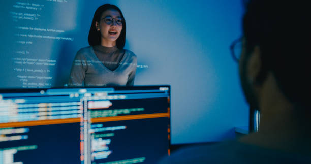 istock Group Asia female software developer mentor leader manager talk strategy plan to executive write prompt AI bot IT app program nomad, video game, designer, data center. Projecting slideshow code. 2166408652