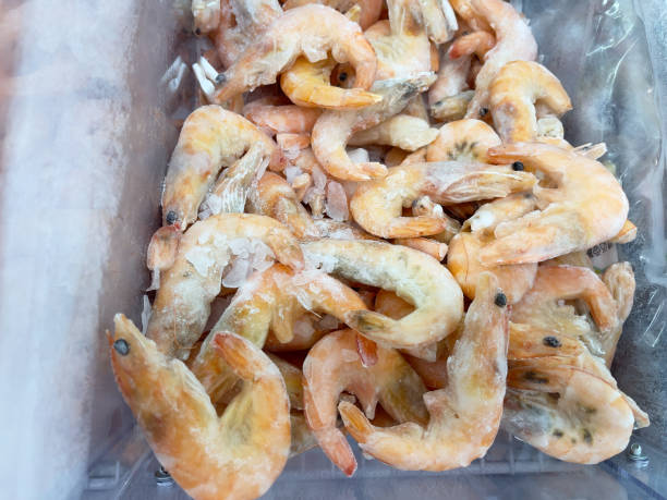 istock Frozen shrimp, close-up. Seafood in a store. 2166409048