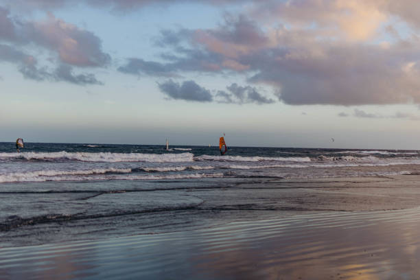 Kiteboarding kite surfers rides the waves on the Caribbean Sea.
