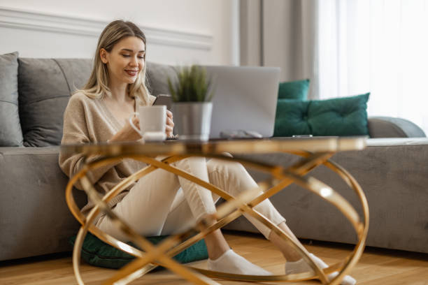 istock Young Woman Working from Home on Laptop 2166412102