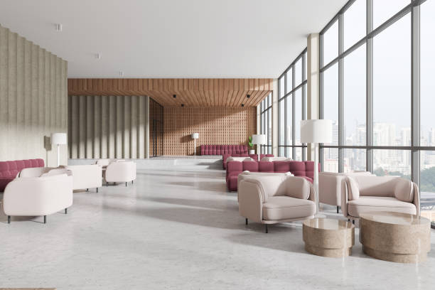 istock Luxury lobby interior with burgundy couch and armchairs, panoramic window 2166412775
