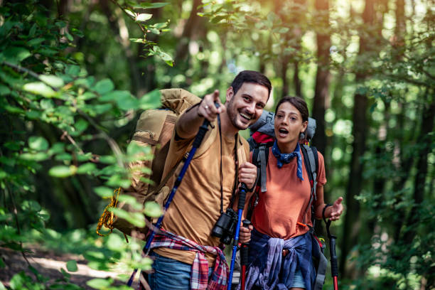 istock Love couple hiking through forest 2166413092