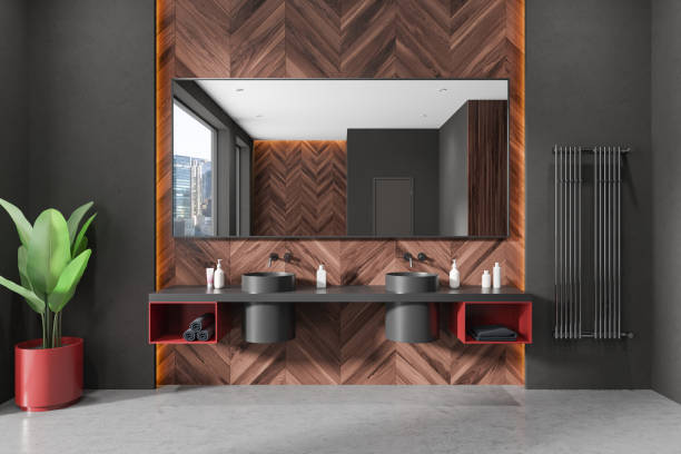 istock Dark hotel bathroom interior with double sink, accessories and panoramic window 2166413286