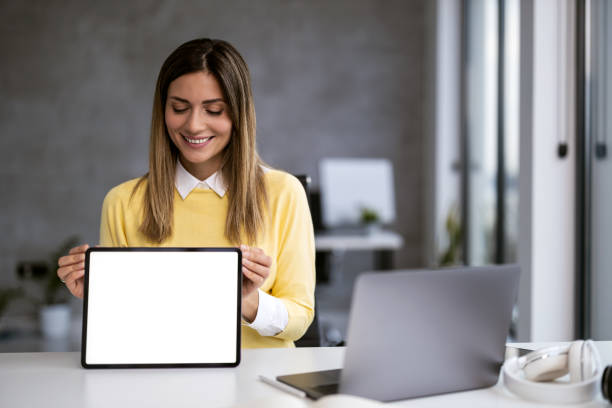 istock Woman Holding Blank Tablet in Modern Office 2166413976