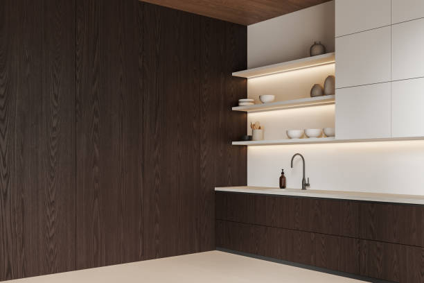 istock Dark wooden home kitchen interior with cooking cabinet with sink. Empty wall 2166414237
