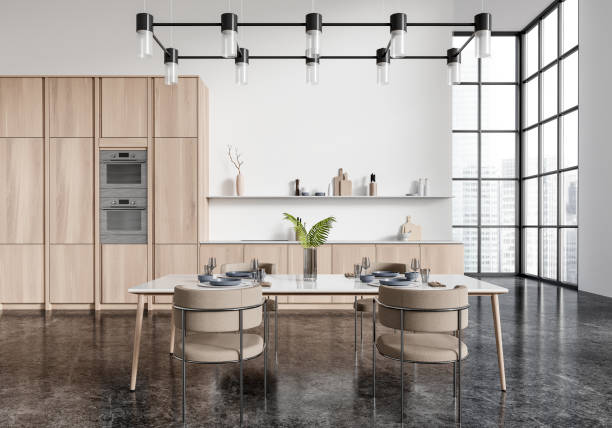 istock Modern kitchen interior with a dining table and chairs, featuring light wooden cabinets and a large window, bright spacious kitchen concept. 3D Rendering 2166414248