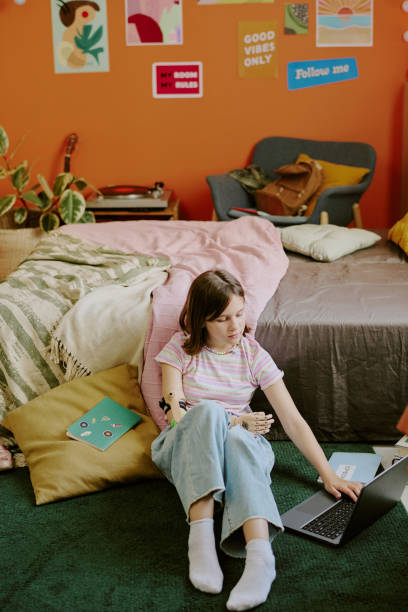 istock Teen Student Using Laptop At Home 2166415124