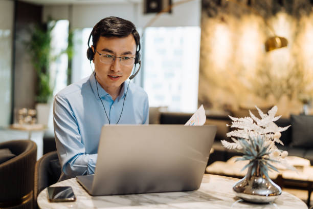 istock Asian businessman on videoconference with headset in modern office, capture the serious emotions. 2166417080