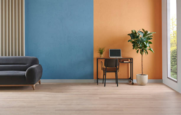 istock Modern working room interior home decoration, orange and blue textured wall background, vase of plant, bike. 2166418405