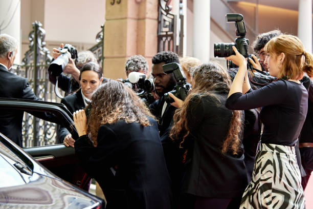 istock Photographers capturing celebrity arrival at media event 2166425159