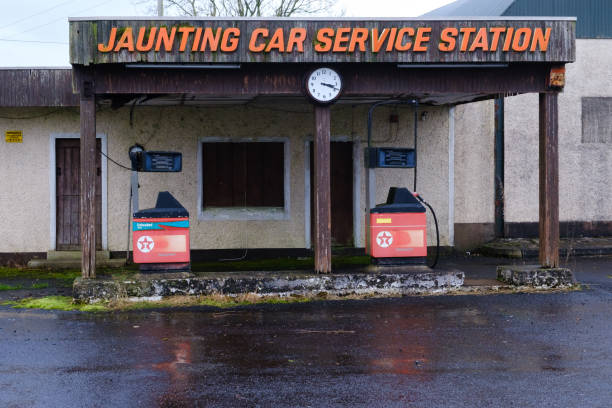 Armoy, UK - December 30th, 2021: Disused Texaco car service station and petrol station with simple retro design elements and old fuel pumps.