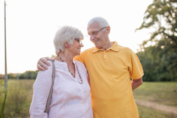 istock Senior couple walking through a forest together 2166427967