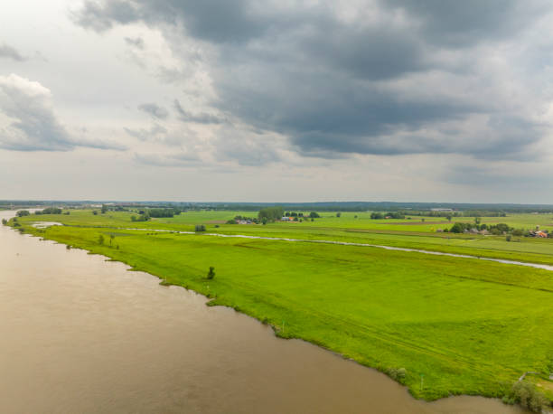 istock IJssel river springtime landscape with a dark sky above 2166428008