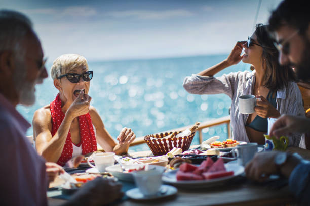 Family having a Breakfast on the Sailing Boat.