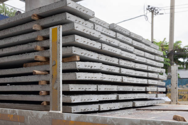 istock A stack of gray concrete sheets with wooden boards on truck. 2166428372