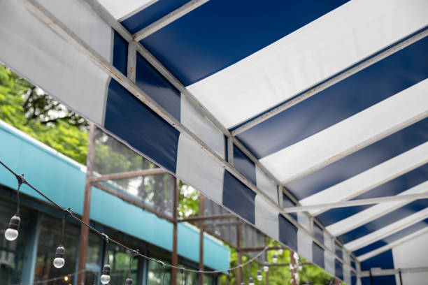 istock A blue and white striped canopy is above a building 2166428422