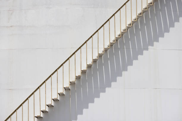 istock A white staircase with a shadow cast on the wall 2166428496