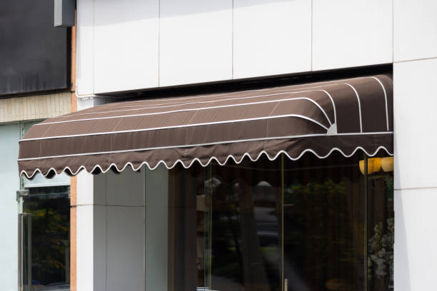 istock A brown awning with white stripes is over a storefront 2166429160