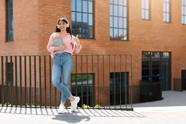 istock Young girl walking confidently at university campus 2166429669