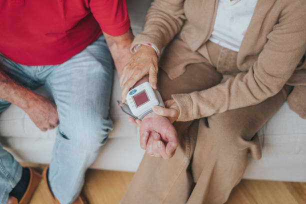 istock Senior couple measuring blood pressure 2166431104