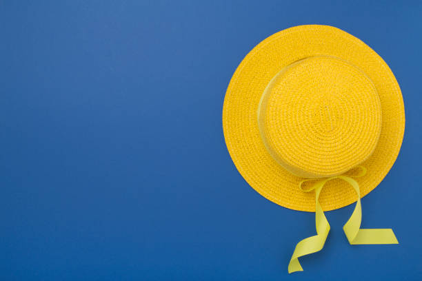 istock Yellow hat on color background, top view. Summer concept 2166432713
