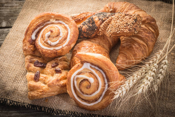 istock fresh bread  and wheat on the wooden 2166433333