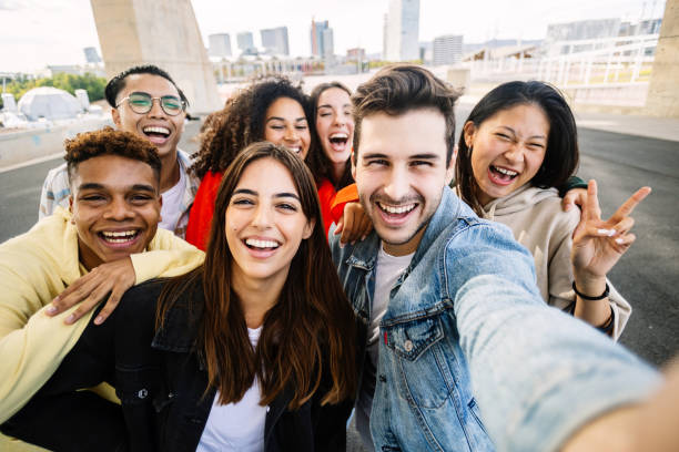 istock Young group of diverse people having fun together outside 2166433514