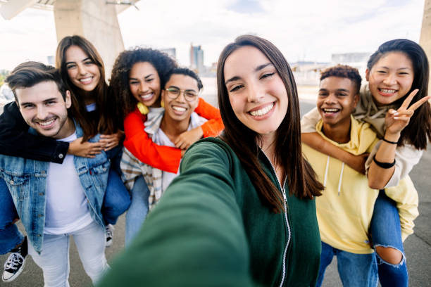 istock Young group of diverse students having fun together outdoors. 2166433536