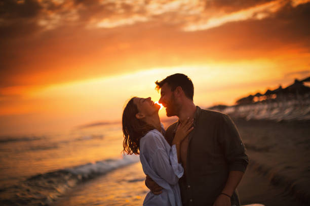 istock Young Couple's romantic moments at the beach. 2166433547