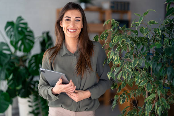 istock Professional Woman Engaged with Tablet in Office Setting 2166433627