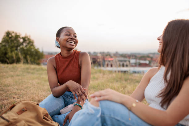 istock Young friends relaxing in a park 2166433635