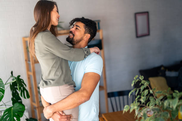 istock Affectionate Embrace Between Diverse Couple Indoors 2166433668