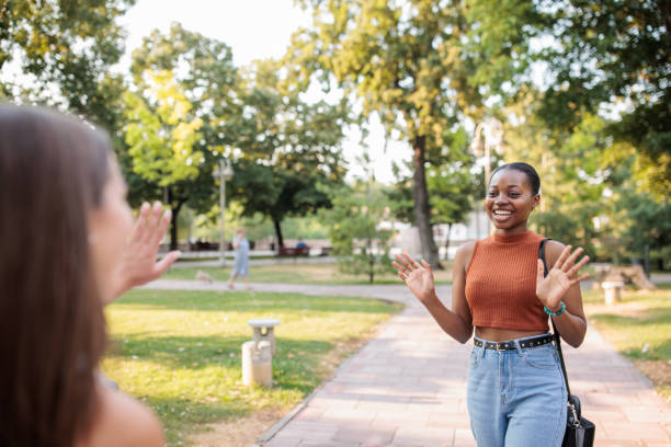 istock Friends meeting in a park 2166433728